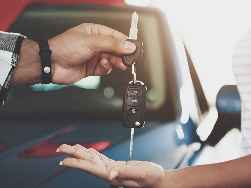City Toyota in Great Falls MT customer handing over keys to their used car