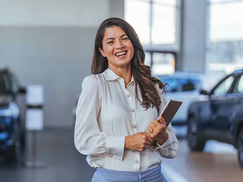 City Toyota in Great Falls MT sales rep holding clipboard