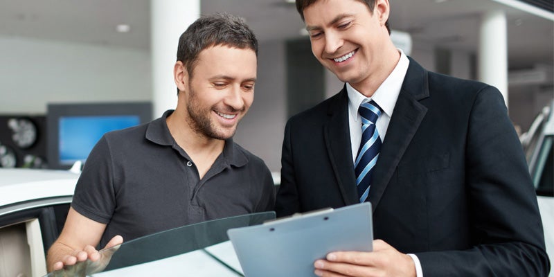 City Toyota in Great Falls MT sales rep going over pricing with customer